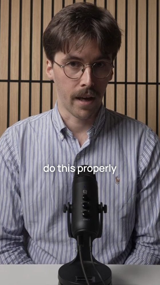 Still from a short video with captions, recorded at a professional video desk