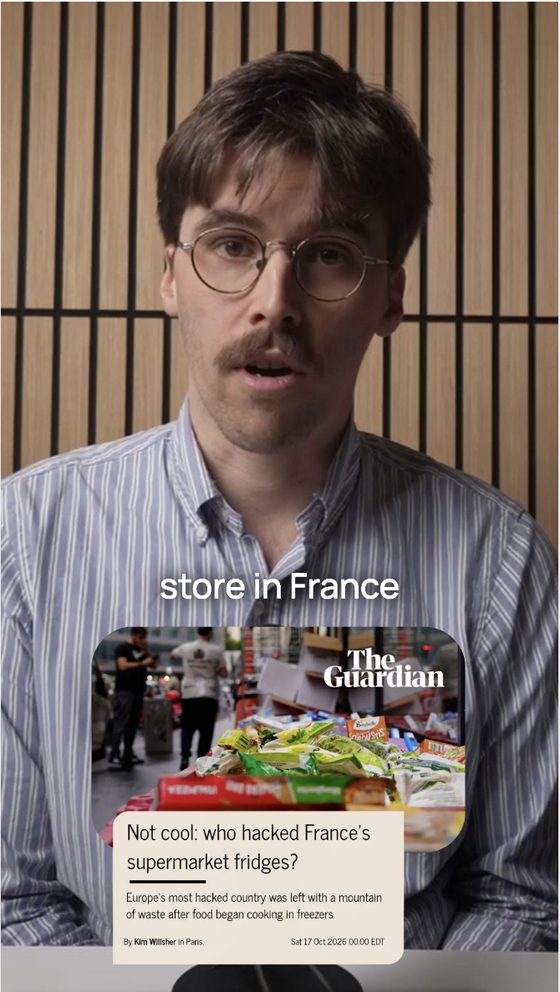 Still from a short video with captions and a news graphic